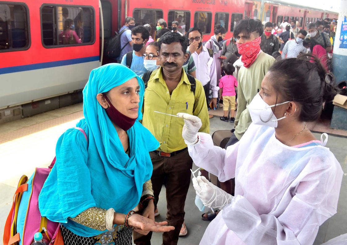 MUMBAI, INDIA JUNE 22: BMC health worker conducts the mandatory Rapid Antigen Test of passengers arriving from outstation trains at Dadar Station, on June 22, 2021 in Mumbai, India. (Photo by Anshuman Poyrekar/Hindustan Times via Getty Images)